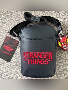 Black Stranger Things Crossbody Bag with Red Logo and key chain